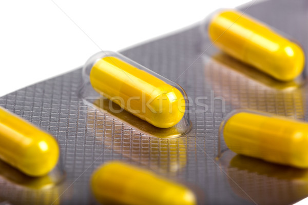Stock photo: Medicine capsules packed in blisters