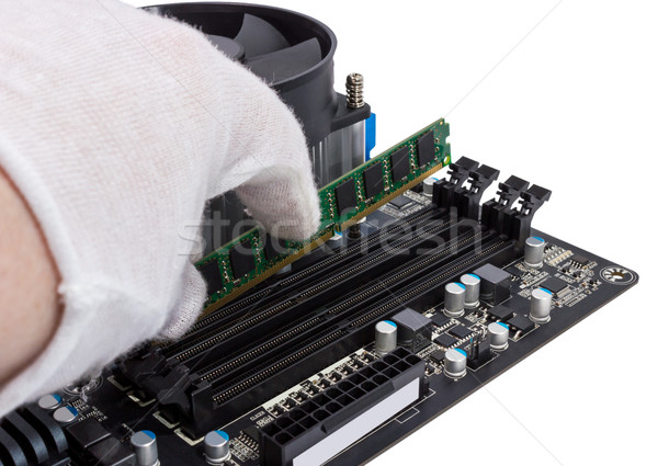 Stock photo: Electronic collection - Installing memory module in DIMM slot on