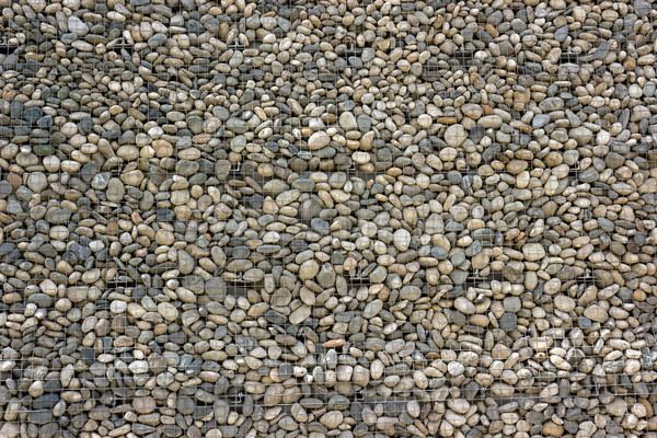 Backgrounds collection - Wall built of sea pebbles Stock photo © nemalo