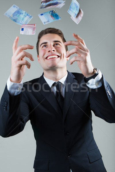 Young man in formalwear throwing money. Stock photo © nenetus