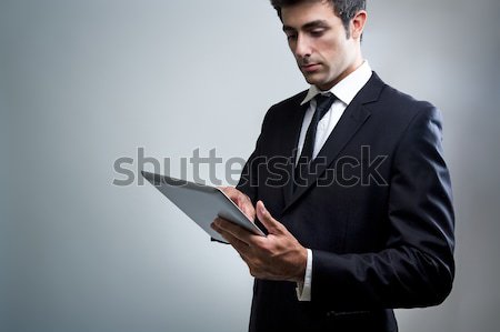 Young Businessman Using Digital Tablet Stock photo © nenetus
