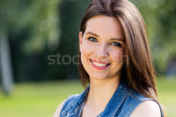 closeup portrait of cute young woman in the park Stock photo © nenetus