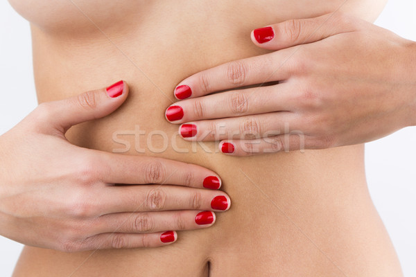 Woman's hands on belly isolated on white background Stock photo © nenetus