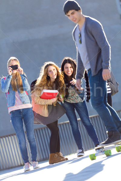 A group of Friends having fun with skate in the street Stock photo © nenetus