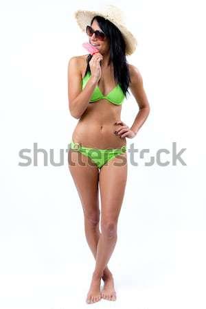 Happy Young girl in bikini, eating an strawberry ice cream Stock photo © nenetus