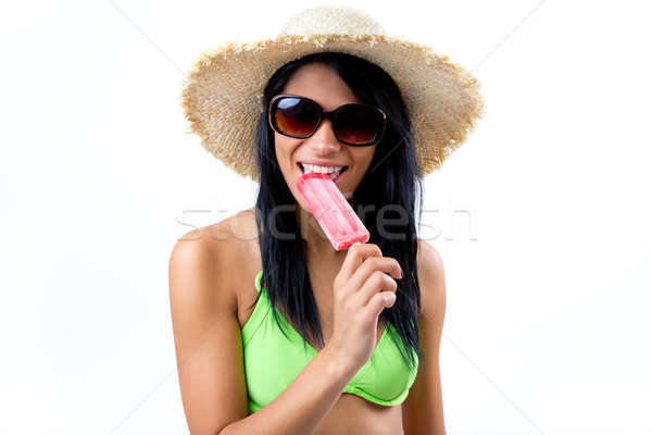 Happy Young girl in bikini, eating an strawberry ice cream Stock photo © nenetus