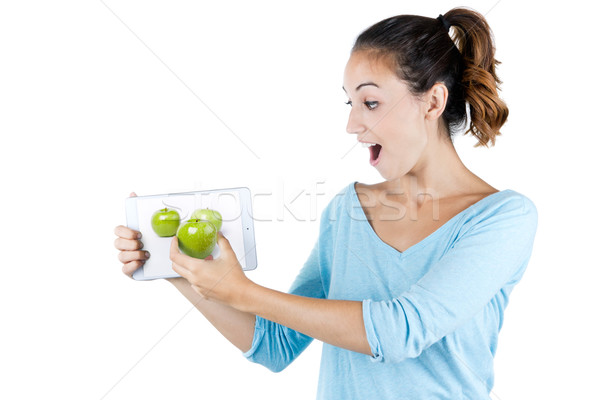 Young woman caught with good definition of a digital tablet scre Stock photo © nenetus