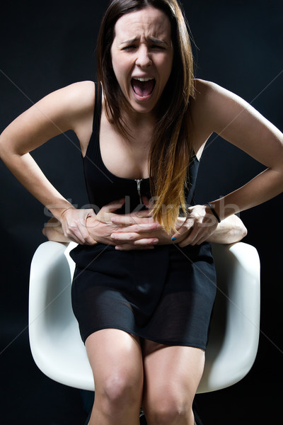 Young woman in a chair caught by a male arms. Concept of oppress Stock photo © nenetus