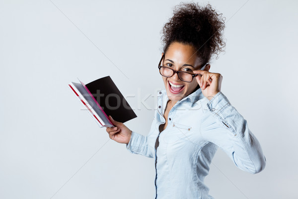 Fiatal afroamerikai nő egy könyv otthon csinos Stock fotó © nenetus