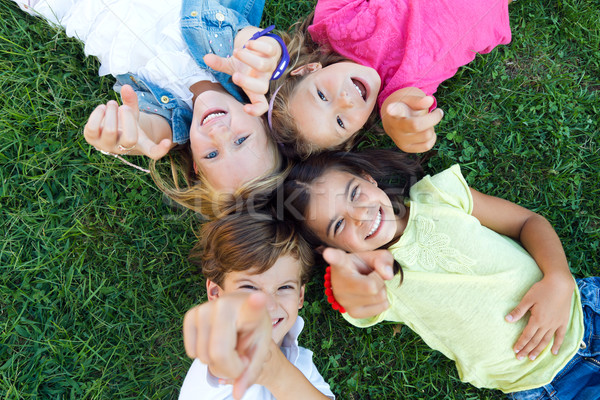 Group of childrens having fun in the park. Stock photo © nenetus