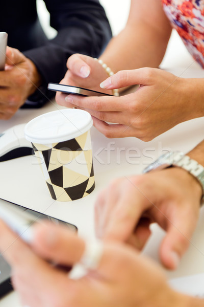 Businesswoman using mobile phone at a meeting. Stock photo © nenetus