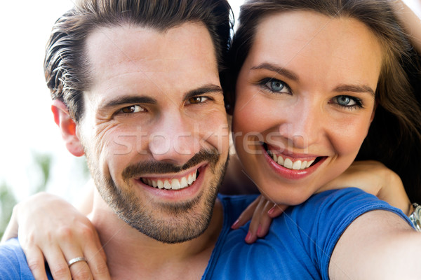 Happy young couple taking selfies with her smartphone in the par Stock photo © nenetus