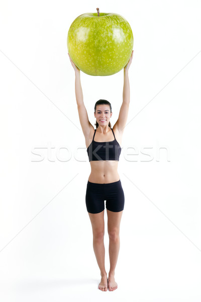 Slender woman in fitness clothes holding a giant apple Stock photo © nenetus