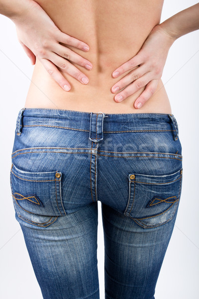 Woman is having a pain in her back Stock photo © nenetus