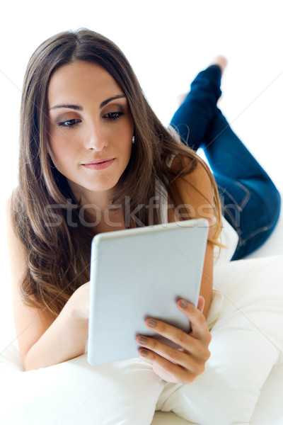 Young woman at home with digital tablet. Isolated on white. Stock photo © nenetus