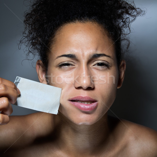 black woman with mouth covered with tape Stock photo © nenetus