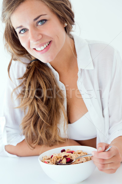 Mulher jovem roupa interior alimentação cereais isolado branco Foto stock © nenetus