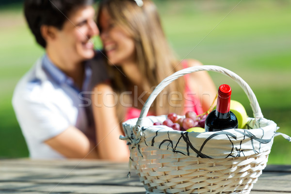 Attractive couple on romantic picnic in countryside. Stock photo © nenetus