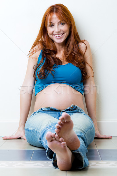 Beautiful pregnant woman relaxing at home.  Stock photo © nenetus