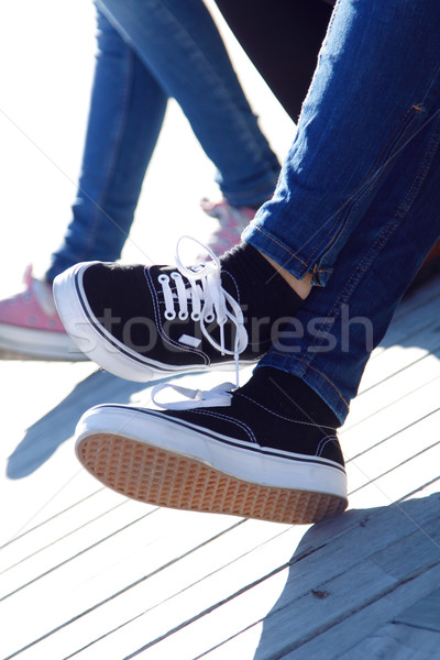 腿 年輕的女孩 牛仔褲 運動鞋 女子 商業照片 © nenetus