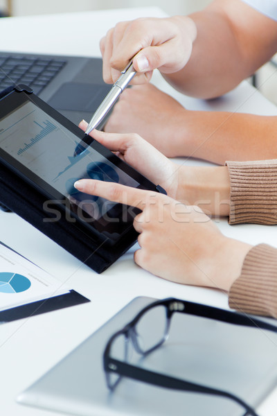 Stock photo: executive hands with digital tablet in a financial meeting