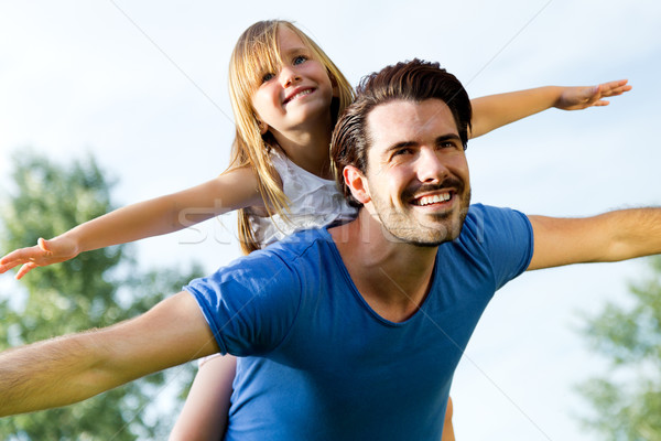 Father and Daughter having fun outdoors Stock photo © nenetus