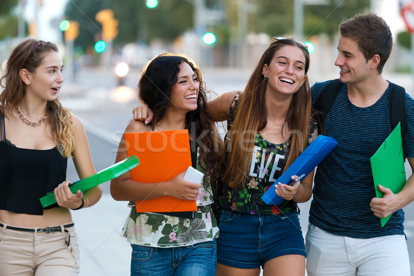 A group of friends talking in the street after class  Stock photo © nenetus