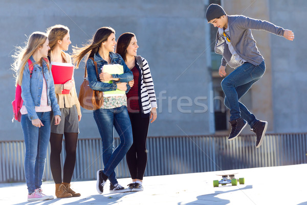 A group of Friends having fun with skate in the street Stock photo © nenetus