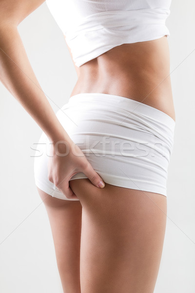 Attractive woman with perfect body checking cellulite on her but Stock photo © nenetus