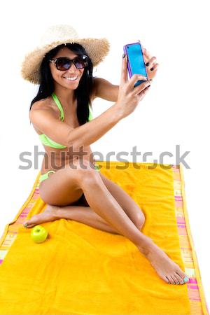 Happy young girl with green bikini and digital table Stock photo © nenetus