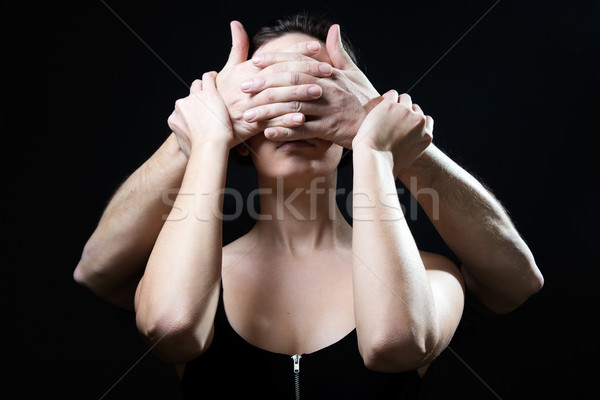Young woman with eyes covered by a male hands. Concept of submis Stock photo © nenetus