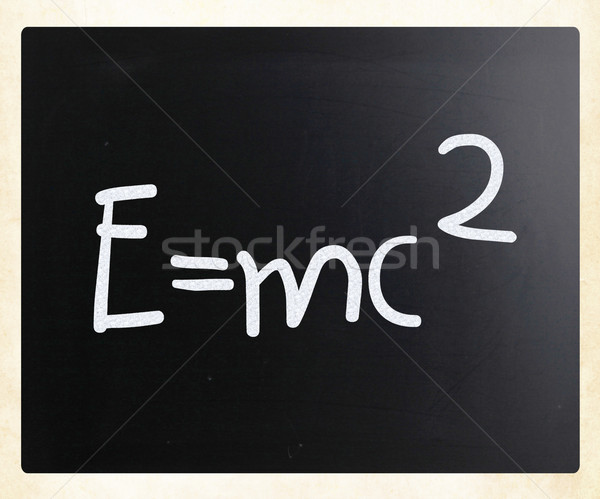 E=mc2 handwritten with white chalk on a blackboard Stock photo © nenovbrothers
