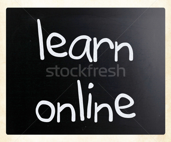 'Learn online' handwritten with white chalk on a blackboard Stock photo © nenovbrothers