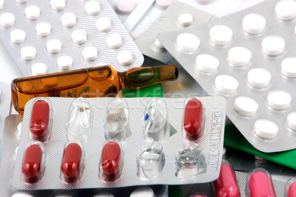 Pills of many shapes and colors grouped together Stock photo © nenovbrothers