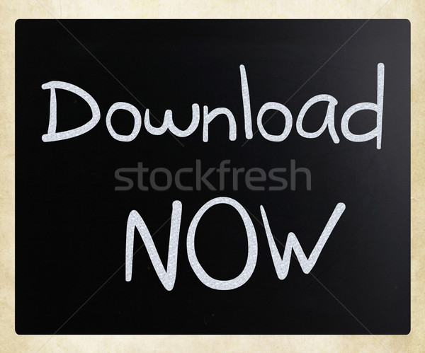'Download now' handwritten with white chalk on a blackboard Stock photo © nenovbrothers