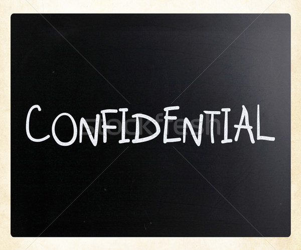 The word 'Confidential' handwritten with white chalk on a blackb Stock photo © nenovbrothers