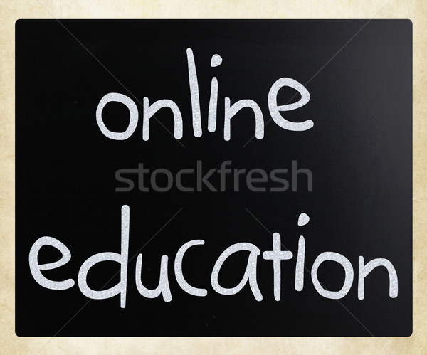 'Online education' handwritten with white chalk on a blackboard Stock photo © nenovbrothers