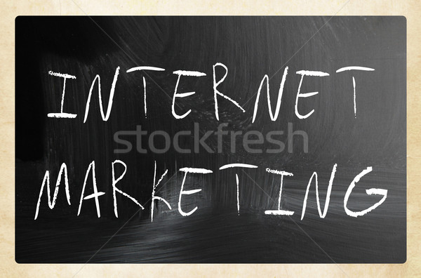 'Internet marketing' handwritten with white chalk on a blackboar Stock photo © nenovbrothers