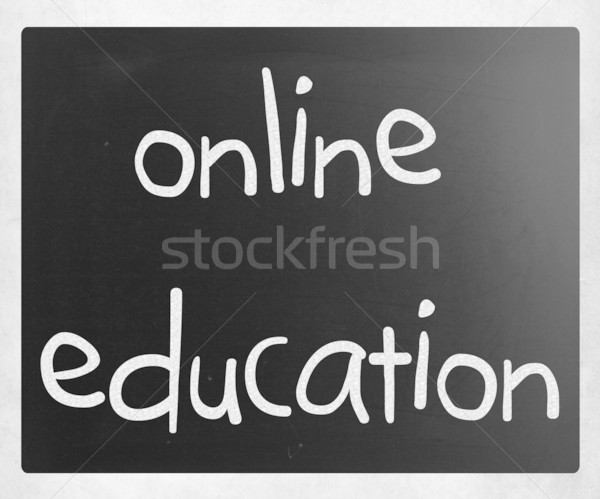 'Online education' handwritten with white chalk on a blackboard Stock photo © nenovbrothers