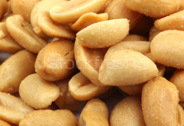 Close up of fried, peeled and salted peanuts. Stock photo © nenovbrothers
