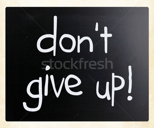 'Don't give up' handwritten with white chalk on a blackboard Stock photo © nenovbrothers