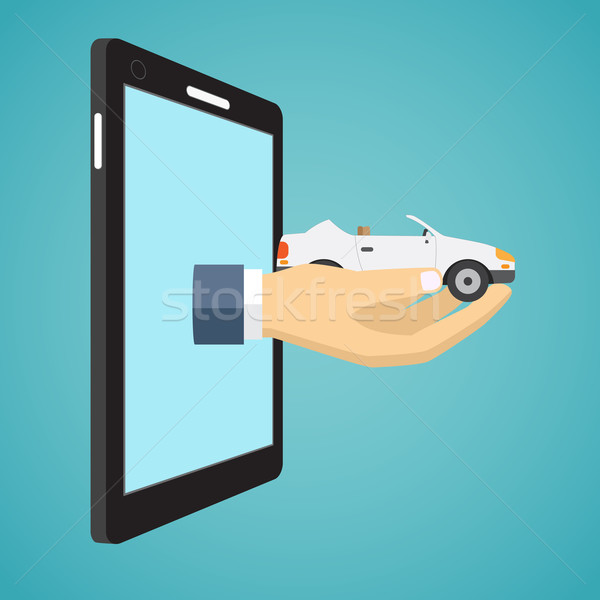 Hand holding car from screen of smartphone. Stock photo © Neokryuger