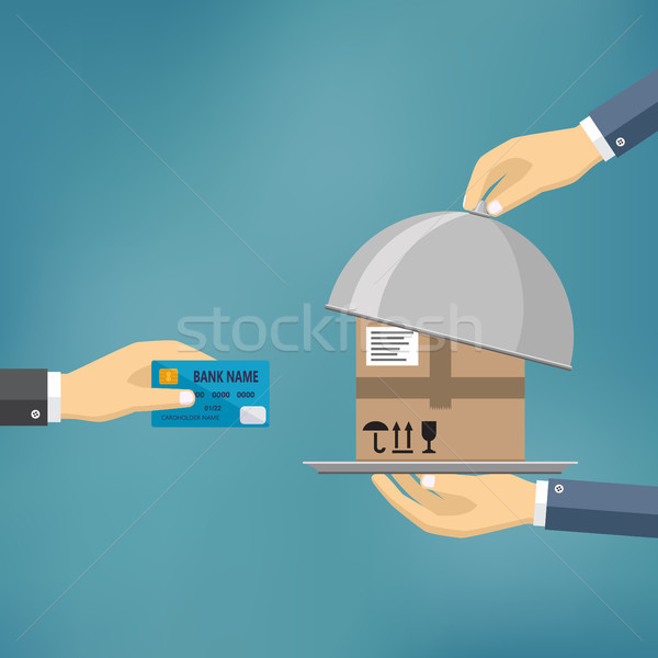Hand with credit card and hand with parcel. Stock photo © Neokryuger