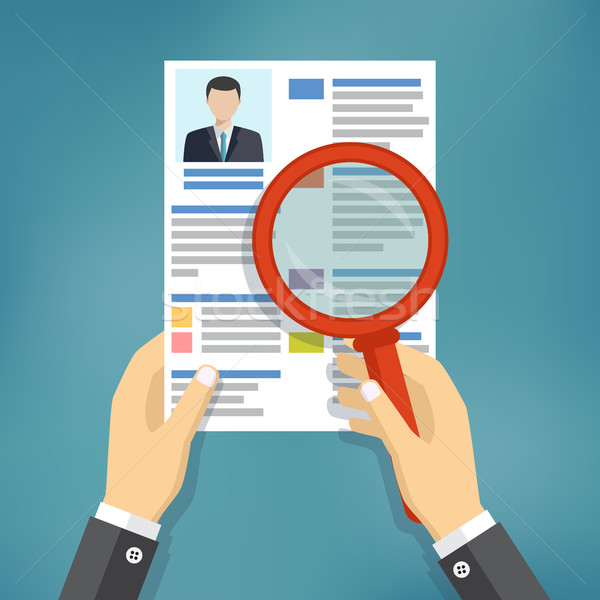 Hands holding a resume and a magnifying glass. Stock photo © Neokryuger