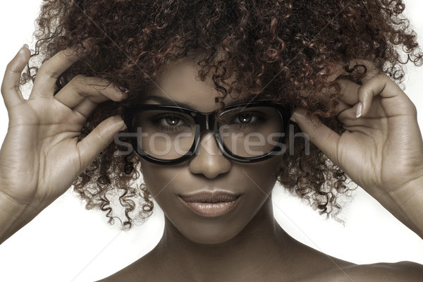 Beautiful girl with afro wearing eyeglasses. Stock photo © NeonShot