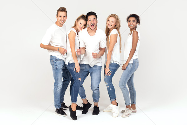 Grupo sorridente pessoas juntos jovem Foto stock © NeonShot