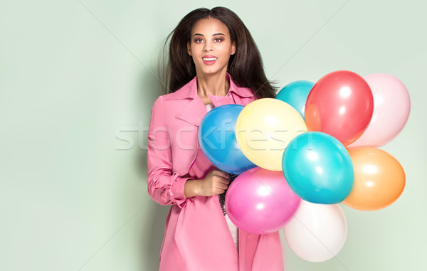 Happy young woman with balloons. Stock photo © NeonShot