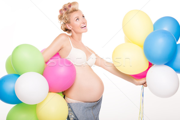 Happy pregnant girl with balloons. Stock photo © NeonShot