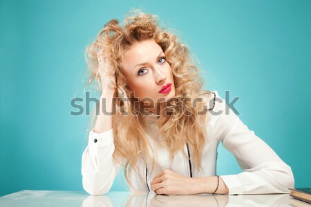 Stock photo: Blonde girl in bed posing.
