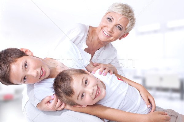 Сток-фото: Семейный · портрет · матери · улыбаясь · красивой · играет · два